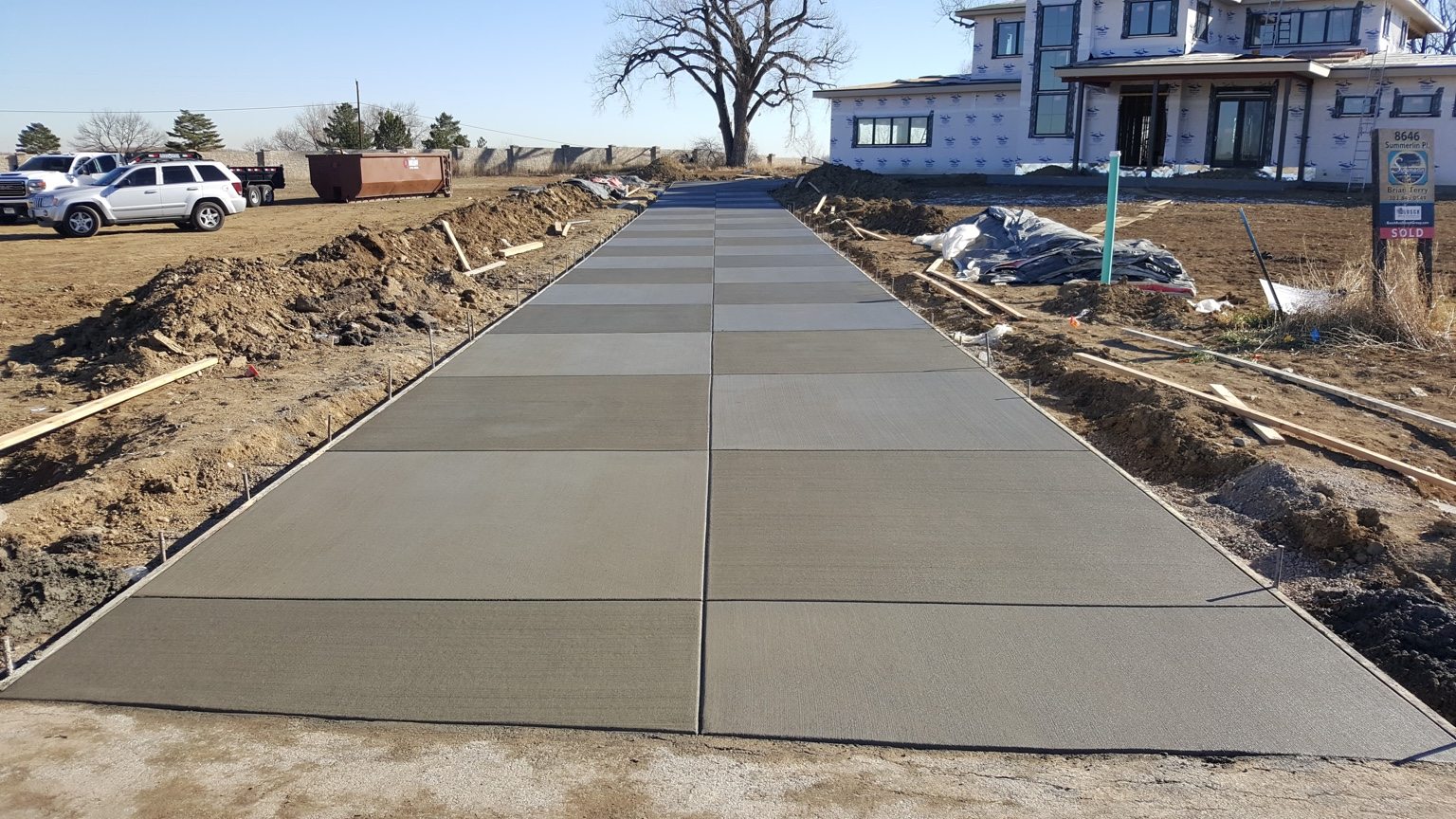 Long newly finished concrete driveway